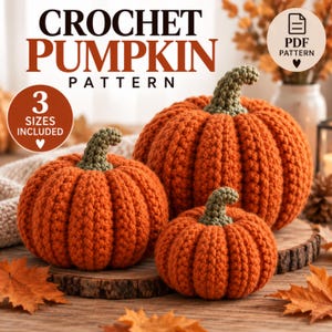 May include: Three crocheted pumpkins in varying sizes with orange yarn bodies and green stems. Text on the image reads: CROCHET PUMPKIN PATTERN, 3 SIZES INCLUDED, and PDF PATTERN. The pumpkins are arranged on wooden slices with scattered autumn leaves.