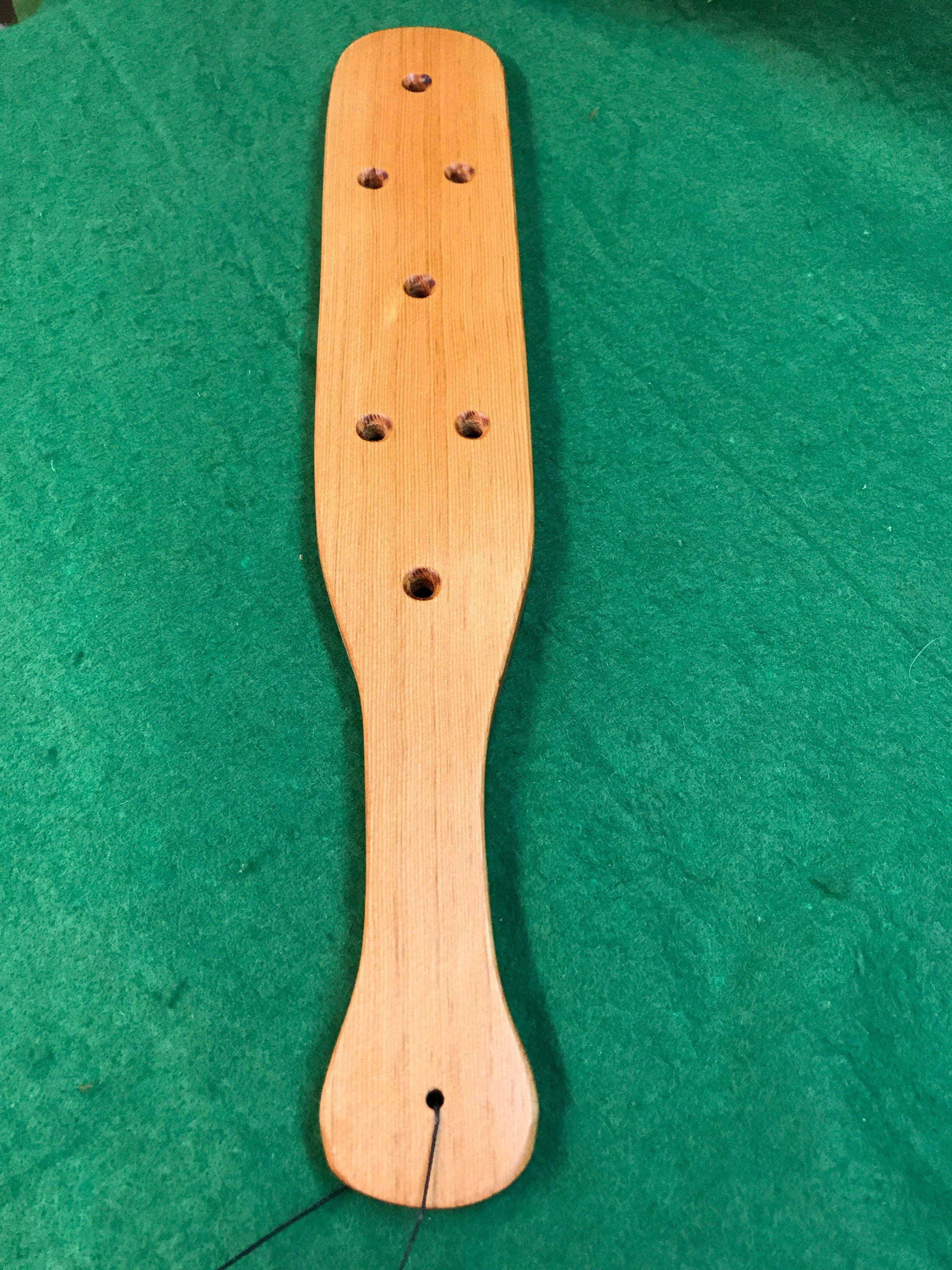 large wooden hand crafted fraternity paddle with holes douglas fir