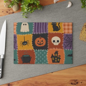 Halloween Patchwork Pattern Glass Cutting Board | spooky pumpkin skull spider