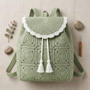 May include: A sage green crochet backpack constructed from square motifs with a semi-circular flap featuring a white scalloped edge. The bag includes a white drawstring closure with two tassels, two shoulder straps, and a top handle.