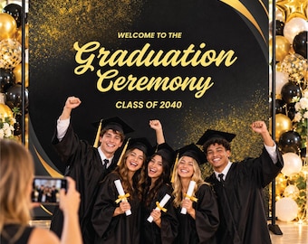 May include: A black and gold graduation backdrop featuring the text "WELCOME TO THE Graduation Ceremony CLASS OF 2040" with gold glitter accents, framed by balloon arches on both sides and four graduates in caps and gowns.