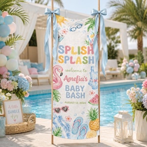 May include: A vertical fabric banner featuring the text SPLISH SPLASH welcome to Amefia's BABY BASH AUGUST 12, 2026. The design includes illustrations of a pink flamingo, blue swimsuit, pineapple, watermelon, sunglasses, and flip-flops, tied with blue ribbons.
