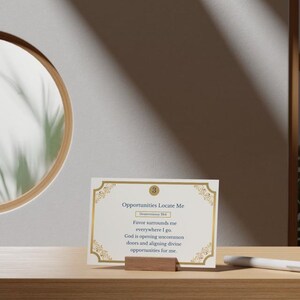 May include: A rectangular white card with gold decorative corners and a gold circle containing the number 3. The text reads: Opportunities Locate Me, Deuteronomy 28:6, Favor surrounds me everywhere I go. God is opening uncommon doors and aligning divine opportunities for me.