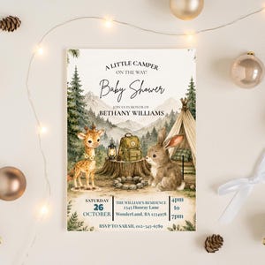 May include: A baby shower invitation with a camping theme. The invitation features a giraffe, a rabbit, a backpack, and a tent. The text reads "A Little Camper On The Way! Baby Shower" and includes the date, time, and location.