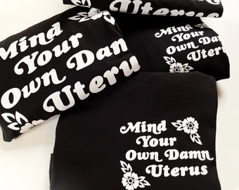 Mind Your Own Damn Uterus - pocket print - Unisex Tee Shirt