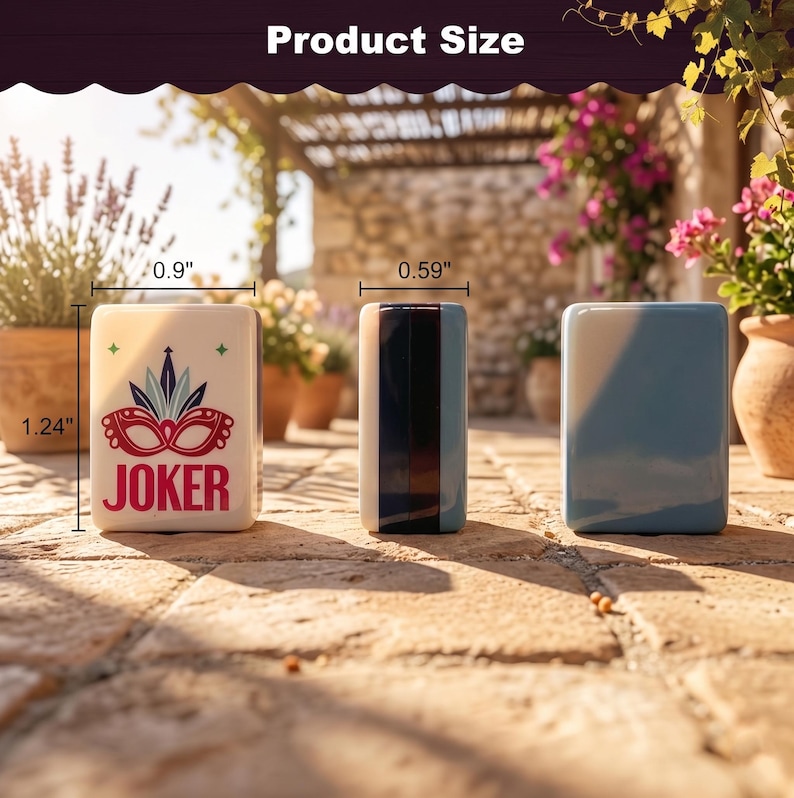 May include: Three ceramic rectangular containers. The first is off-white with a red and blue mask design and the word "JOKER". The second is a vertical rectangle with black, white, and blue stripes. The third is solid light blue. The first is 1.24" tall and 0.9" wide.