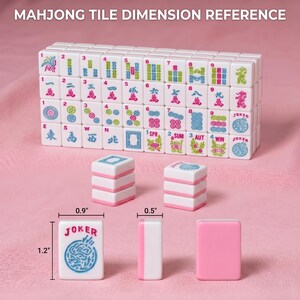 May include: White and pink Mahjong tiles with dimensions displayed. The text "MAHJONG TILE DIMENSION REFERENCE" is at the top. The tiles are stacked and arranged to show the different tile designs. The dimensions are 1.2" x 0.9" x 0.5".