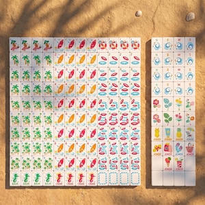 May include: A complete Mahjong set with tiles featuring beach-themed illustrations. The tiles display images of palm trees, surfboards, and seahorses, along with numbers and suits. The set includes a rack of tiles with directional symbols and joker tiles.