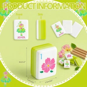 May include: A set of white and green Mahjong tiles. One tile features a pink flower and the number 1. Other tiles show a green and pink figure and the word "JOKER". The tiles measure 2.3 inches by 0.9 inches.