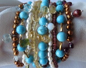 Multi strand turquoise, pearl,semi preciouse stones and sterling silver bracelet.Aquamarine, garnets,citrine,fresh water pearls.
