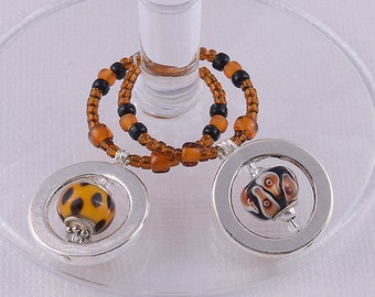 Orange and Black Spinner Wine Charms: Halloween Decor, Animal Print, Lampwork beads. LIMITED EDITION