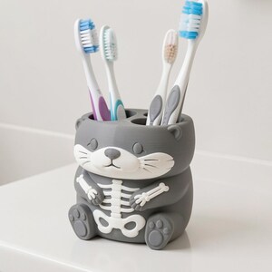 Skeleton Otter Toothbrush Holder, 3D Printed Spooky Bathroom Decor, Unique Hand-Painted Vanity Organizer for One Toothbrush image 3