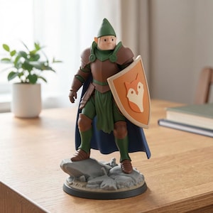 May include: A figurine of a knight in green and brown armor, a blue cape, and a green hat. The knight holds a shield with a fox emblem. The figurine stands on a gray stone base.
