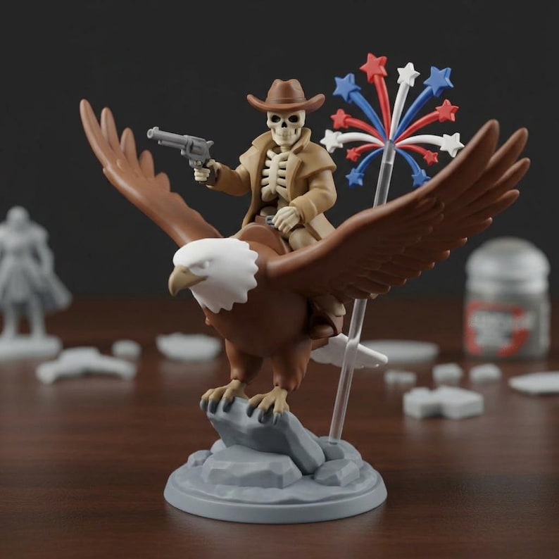 May include: A figurine of a skeleton cowboy riding a brown eagle, holding a gun. The eagle is perched on a gray rock base. The cowboy wears a brown hat and coat. A firework display is held in the eagle's other claw.