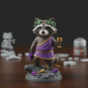 May include: A figurine of a raccoon dressed in a purple toga and laurel wreath, holding a golden goblet and grapes. The raccoon stands on a gray base with grapes and goblets. The figurine has a gray and white face and a bushy tail.