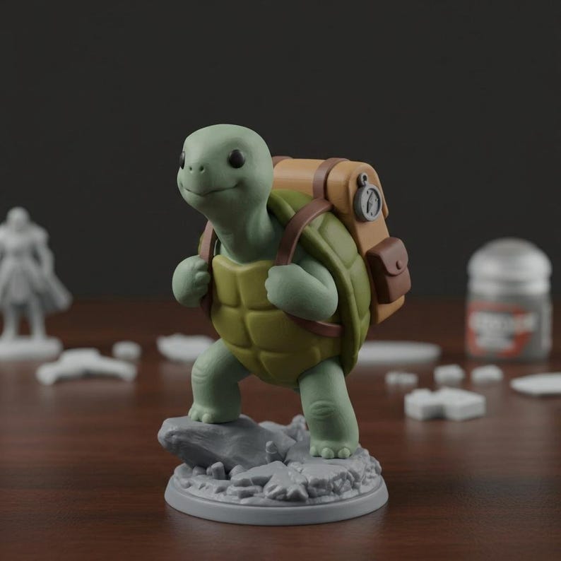May include: A green and yellow turtle figurine with a backpack, standing on a gray base. The turtle has a smiling face and is wearing a brown backpack with a compass. The figurine is likely a miniature for tabletop gaming or a collectible.