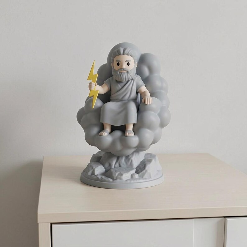 May include: A gray figurine of Zeus, seated on a cloud, holding a yellow lightning bolt. The figurine has a beard and is wearing a toga. The base is a rocky design. The figurine is on a light-colored surface.