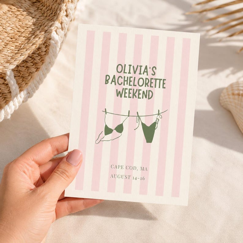 May include: A rectangular card with a light pink and white vertical striped background. The text reads OLIVIA'S BACHELORETTE WEEKEND in green, with a line drawing of two green bikinis hanging on a clothesline. Below, it says CAPE COD, MA AUGUST 14-16.