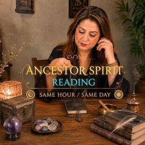 May include: A woman with long brown hair is seated at a wooden table, holding a pendulum. The table features a variety of items, including a crystal ball, a small chest, a plate of stones, and books. The text "ANCESTOR SPIRIT READING" is displayed.