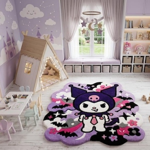May include: A plush area rug featuring a central graphic of a purple and white cartoon character with a skull emblem, surrounded by black bats, pink flowers, and stars on a light purple background, placed in a child's bedroom with a teepee.