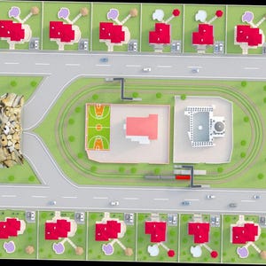 May include: Overhead view of a planned community with red-roofed houses, roads, and green spaces. A basketball court, a building with a red roof, and a mosque-like structure are also visible. Cars are parked along the roads.