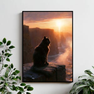 May include: A framed wall art print featuring a black cat sitting on a rocky cliff edge overlooking a coastal landscape at sunset. The scene displays tall cliffs, ocean waves, and a bright golden sun glowing through the hazy horizon sky.