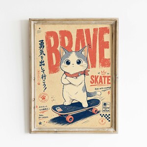May include: Framed vintage-style print featuring a cartoon cat on a skateboard. The cat, with gray and white fur and a red scarf, stands confidently. The word "BRAVE" is in large red letters above the cat, with "SKATE" below. Japanese text is also present.