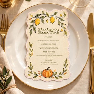 May include: A scalloped-edge Thanksgiving Dinner Menu card featuring watercolour illustrations of lemons and vines at the top and a pumpkin with foliage at the bottom. The text lists courses including starter, second course, main course, and dessert.