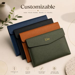 May include: Four rectangular document folders in navy blue, black, tan, and olive green with a textured finish. The olive green folder features the name Lisa embossed in gold on the flap. Text above reads Customizable Add your name. Make it yours.