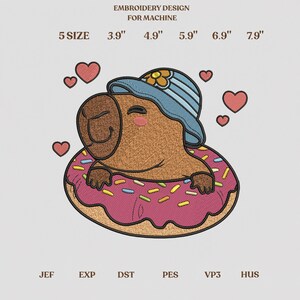 May include: Machine embroidery design featuring a brown capybara wearing a blue bucket hat with a yellow flower, sitting inside a pink frosted doughnut with colourful sprinkles. Text includes EMBROIDERY DESIGN FOR MACHINE, 5 SIZE 3.9" 4.9" 5.9" 6.9" 7.9", and file formats JEF, EXP, DST, PES, VP3, HUS, surrounded by red hearts.
