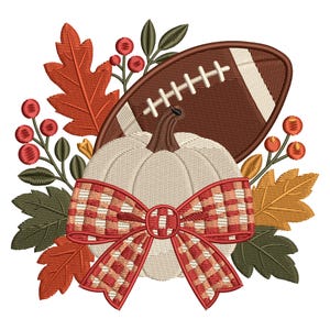 May include: An embroidered design featuring a white pumpkin with a red and white plaid bow, a brown football, and autumn foliage including orange and yellow leaves and red berries. The composition is arranged in a decorative seasonal cluster.
