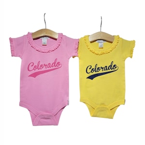 Baby Colorado Pink Ruffel Bodysuit. Limited edition.