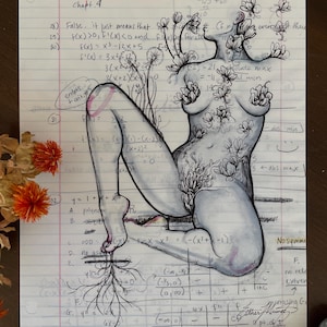 May include: A black and white line drawing of a female figure with flowers growing from her body. The drawing is on a sheet of lined paper with handwritten math equations and notes.