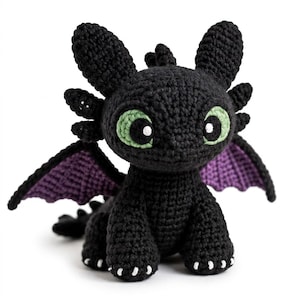 May include: A black crocheted dragon plush toy with large, light green eyes featuring black pupils and white highlights. The creature has pointed ears, small side horns, and purple-accented wings. It has white stitched claws on its feet.