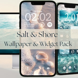 May include: A digital display set featuring a computer monitor and two smartphones showcasing the Salt & Shore Wallpaper & Widget Pack. The screens display beach-themed imagery with seashells, ocean waves, and custom app icons in soft blue tones.
