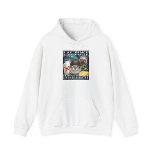May include: White hoodie with a front graphic featuring a cat wearing a helmet, a dog, a carton of milk, and a cheese wedge. The graphic includes the words "LACTOSE" and "INTOLERANT".