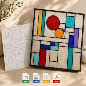 May include: A square stained glass panel featuring a geometric composition of textured clear glass and vibrant colored shapes including red, orange, yellow, blue, and purple. A numbered paper pattern guide is included with the panel for assembly.