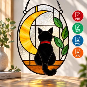 May include: An oval stained glass suncatcher featuring a black cat with a red collar sitting on a ledge in front of a yellow crescent moon and green leaves. The piece is framed in black metal and hangs from a chain, with PDF, SVG, PNG, and JPG icons.