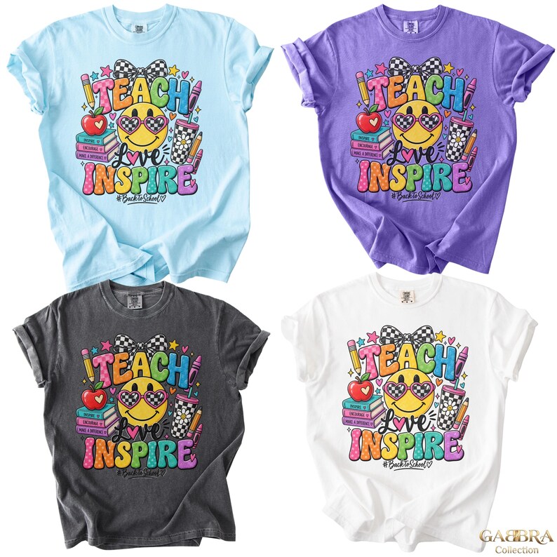 May include: Four short-sleeve t-shirts in light blue, purple, dark gray, and white. Each features a graphic with a smiley face wearing checkered sunglasses, a bow, books, a pencil, and the text "TEACH LOVE INSPIRE" and "#BackToSchool".