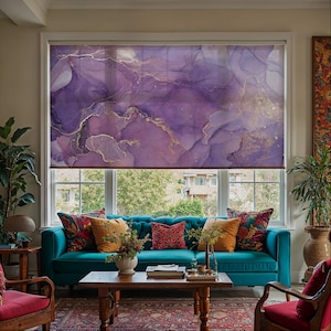 May include: A window roller shade featuring an abstract alcohol ink design in shades of deep purple, lavender, and white, accented with thin, flowing gold veins that create a marbled effect across the entire surface of the rectangular fabric.