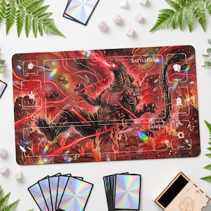 May include: A rectangular playmat featuring a large, dark, reptilian monster breathing fire amidst a burning city. The design includes labelled zones for Battlefield, Life Total, Commander, Library, Graveyard, Lands, and Exile, with holographic accents.