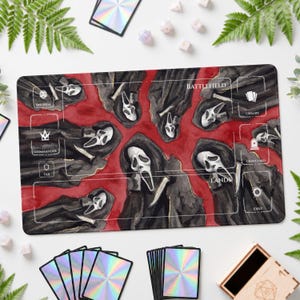 May include: A rectangular playmat featuring a watercolor-style illustration of multiple figures in black hooded robes and white ghost masks against a red background. The mat includes white printed zones labeled Battlefield, Library, Graveyard, Exile, Lands, Commander, Tax, and Life Total.