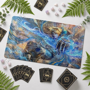 May include: A rectangular playmat featuring a League of Legends character illustration in blue and gold tones, with a numbered track from zero to six. The mat is surrounded by black card decks, a matching box, and several polyhedral dice.