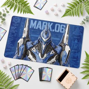 Op de afbeelding: Een rechthoekige bureaumat met een blauw-witte illustratie van de Evangelion Mark.06 robot. Het ontwerp bevat technische schema's, de tekst MARK.06 en diverse mechanische details in een blauwdrukstijl op een donkerblauwe achtergrond.