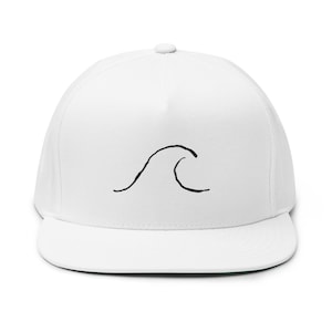 May include: A crisp white five-panel snapback cap featuring a simple, hand-drawn style black line art graphic of a single ocean wave centered on the front crown. The hat has a structured front panel, a flat brim, and a small button on top.