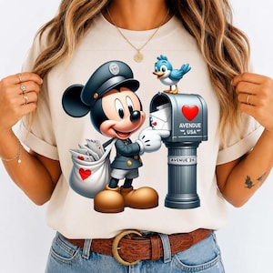 May include: A cartoon illustration of Mickey Mouse dressed as a mail carrier, delivering mail to a mailbox. The mailbox is gray with a red heart and the text "AVENUE USA" and "AVENUE 26". A blue bird sits on top of the mailbox. Mickey Mouse carries a bag of mail with a red heart.
