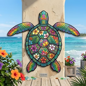 May include: A wall-mounted sea turtle decoration featuring a vibrant, multi-colored stained glass-style pattern on its shell and flippers. The shell is divided into hexagonal segments filled with various tropical flowers and green leaves.
