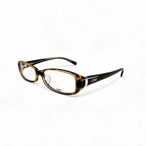 May include: Tortoiseshell-patterned eyeglasses with oval-shaped frames. The temples are dark brown with a silver-toned metal accent near the hinge. The word Lones is printed in black on the right lens and on the outer side of the left temple.