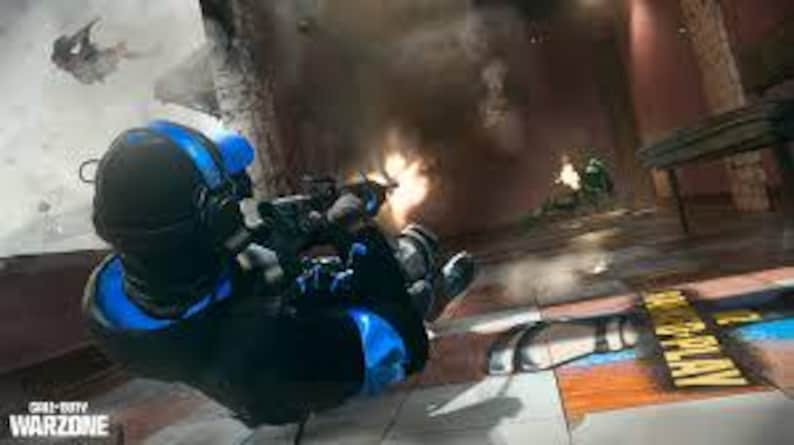 May include: A person in a black and blue tactical suit, helmet, and gloves, aiming a rifle. The scene is a war zone with explosions and other soldiers in the background. The game title "Call of Duty Warzone" is visible.