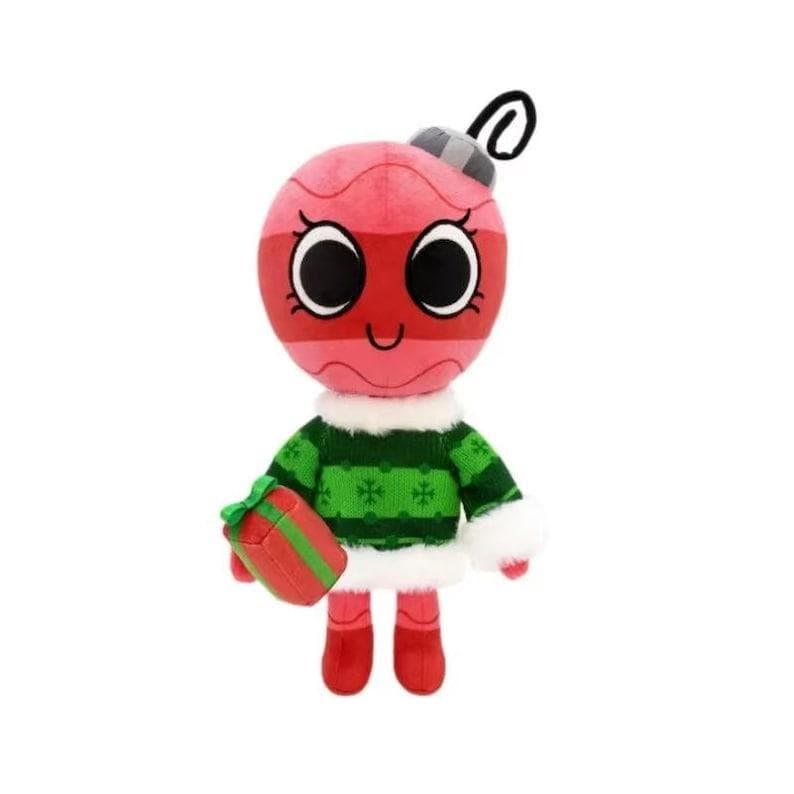 May include: A plush toy shaped like a round red Christmas ornament with large black eyes, wearing a green sweater with white snowflake patterns and white faux fur trim. The toy has a grey cap with a black loop and holds a small red gift box.